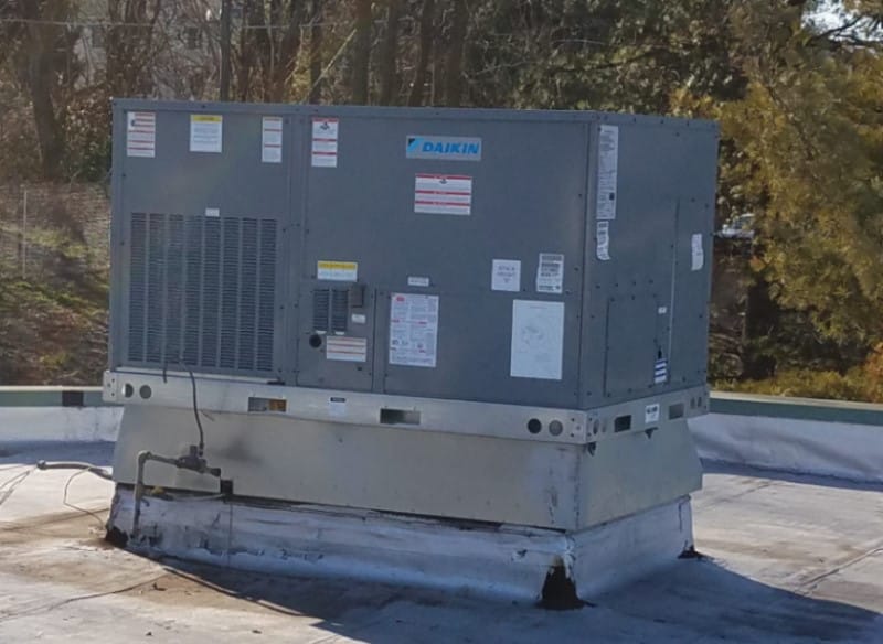 Daikin commercial rooftop HVAC unit on warehouse roof in Elkridge MD