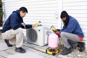 ac air care technicians installing a Daikin brand in Elkridge, MD